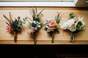 Four corsages made of exotic flowers